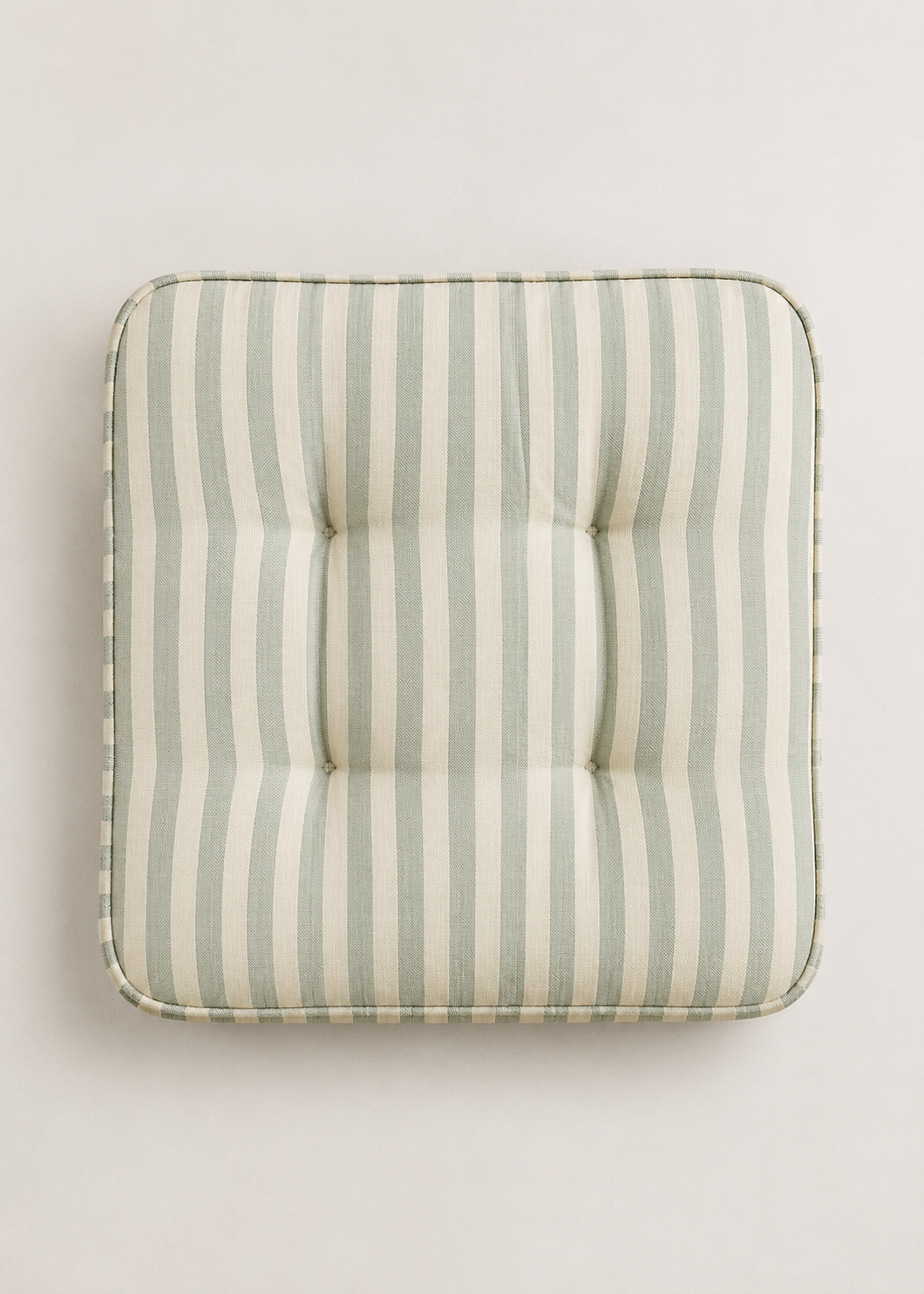 Neutral striped tufted floor cushion with carry handle